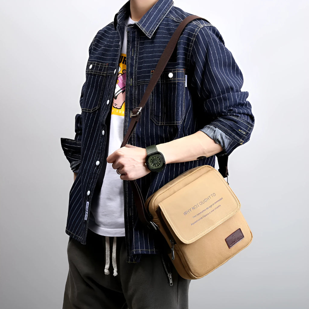 Canvas shoulder bag in khaki with polyester lining, small size 20x7x23cm, shown as a structured day bag