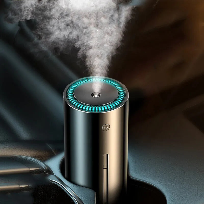 Black aluminium alloy car humidifier with USB cable and 12V car adapter plug on a desk.