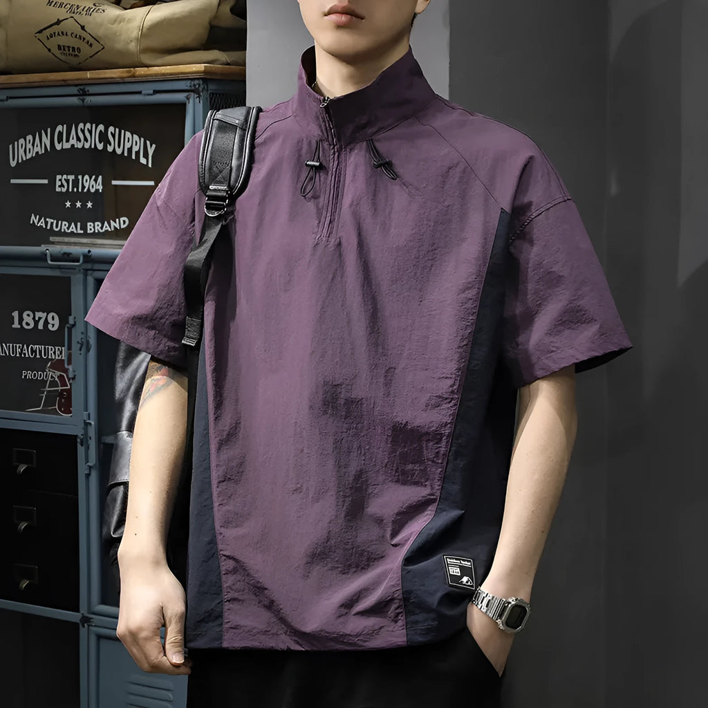 Brown men's half-zip stand collar casual shirt with short sleeves on a hanger.