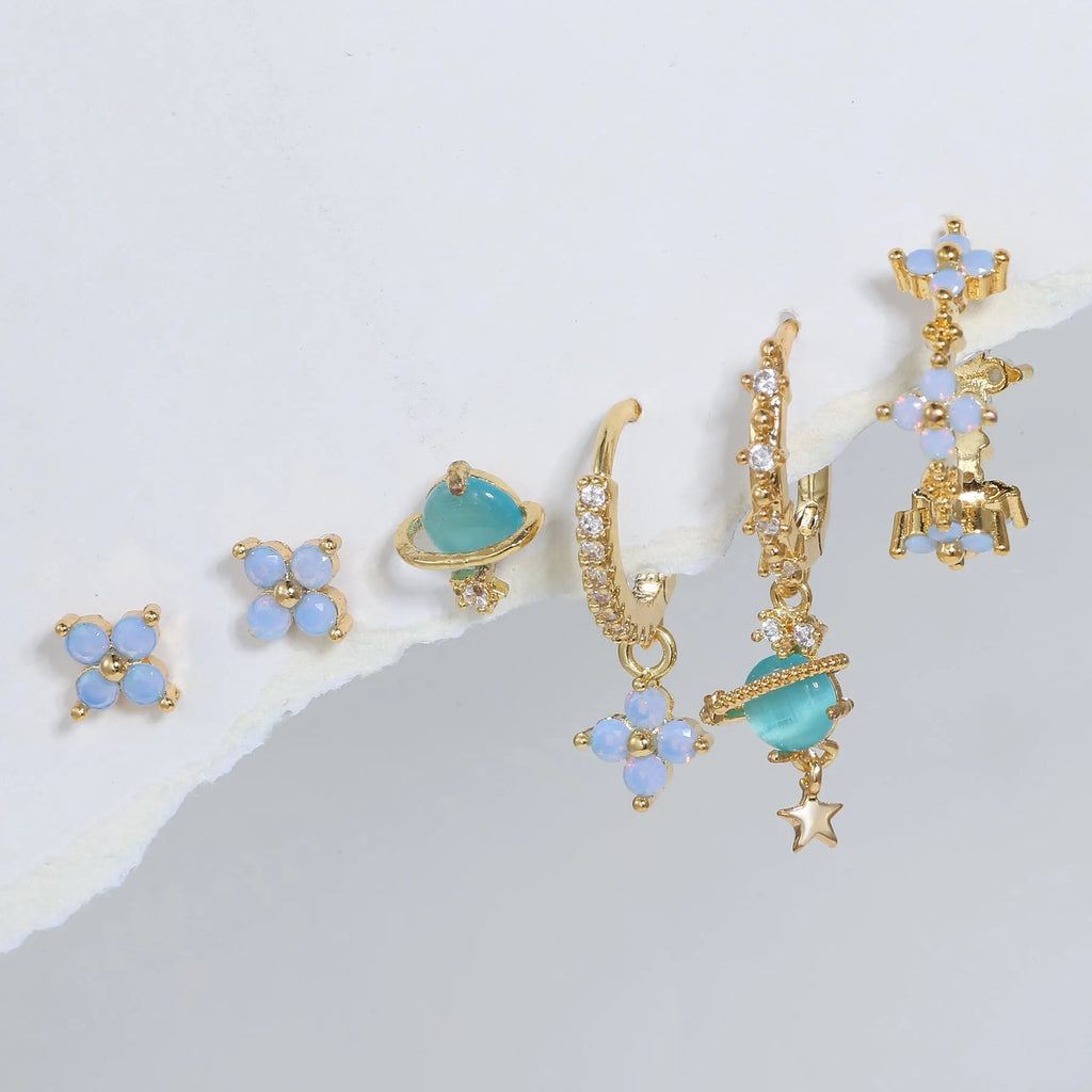 Gold and silver floral ear studs with blue zircon flower nail detail in Japanese Korean style