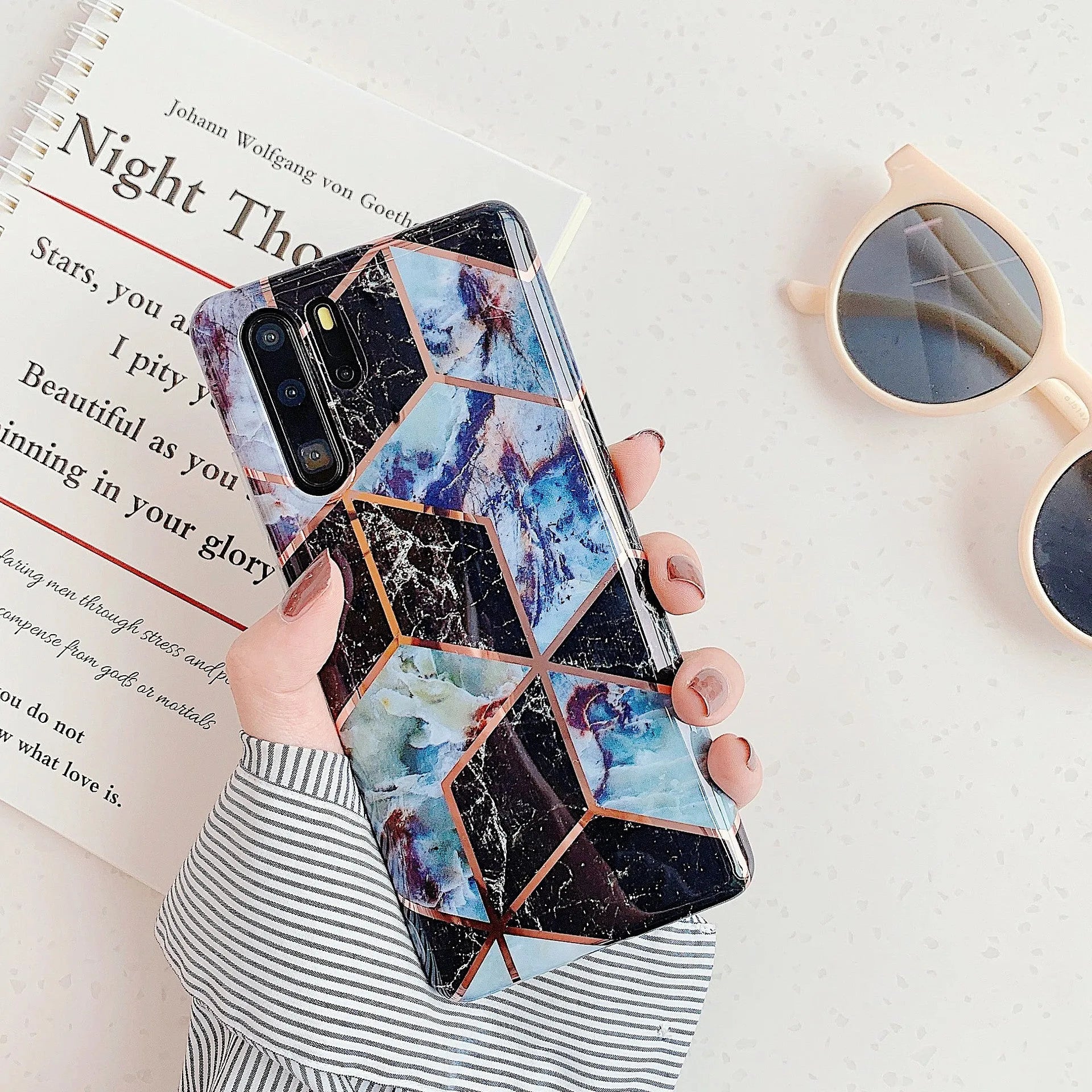 Electroplated marble pattern TPU back cover case for a Huawei or Samsung smartphone.
