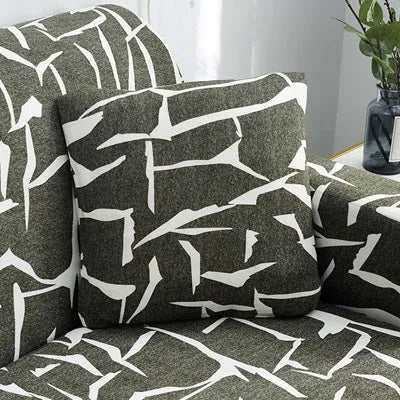 Geometric patterned stretch sofa slipcover fitted on a three-seater sofa