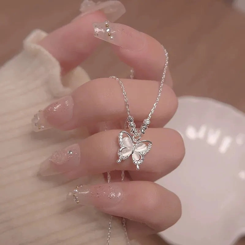 Silver-colour women's butterfly pendant necklace on a cross chain, showing adjustable length between 41cm and 50cm.
