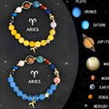 A set of two natural stone beaded bracelets featuring zodiac sign designs.