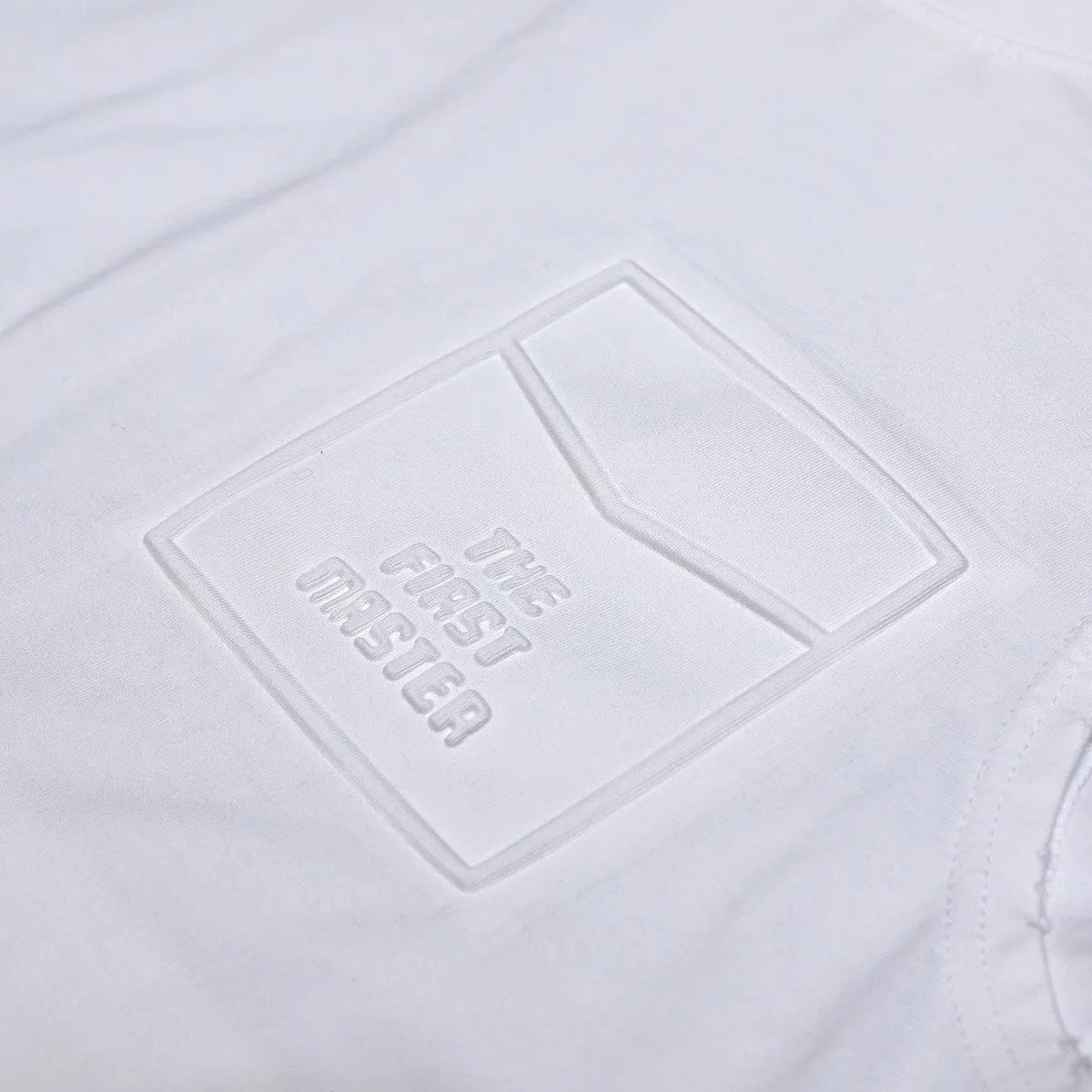 A solid colour loose-fitting cotton sleeveless T-shirt with a straight hem, shown in white.