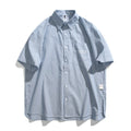 Blue striped loose fit overalls shirt with short sleeves and cardigan style design
