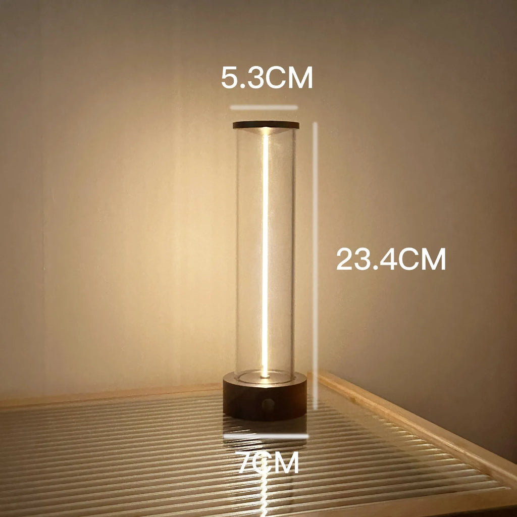 Modern glass USB LED night light with magnetic strip on a metal surface.