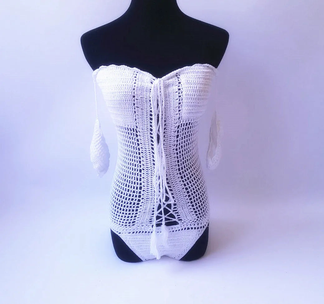 Off-shoulder one-piece swimsuit in polyester fabric on a mannequin.