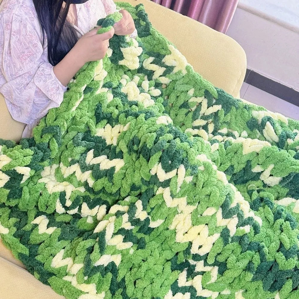 Coarse yarn chenille knitted blanket with braided gravity detail in modern colour option