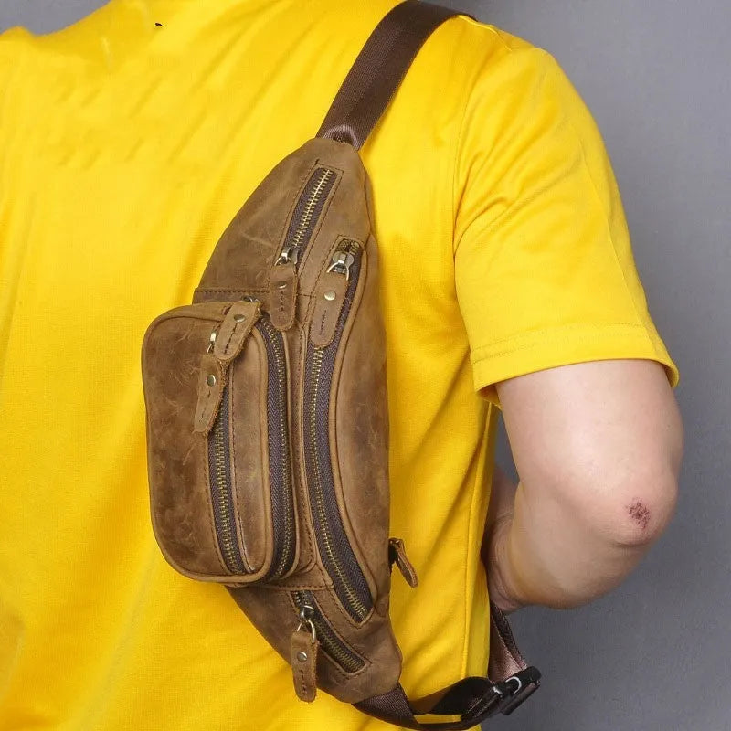Brown leather shoulder messenger bag with single strap showing interior polyester cotton lining