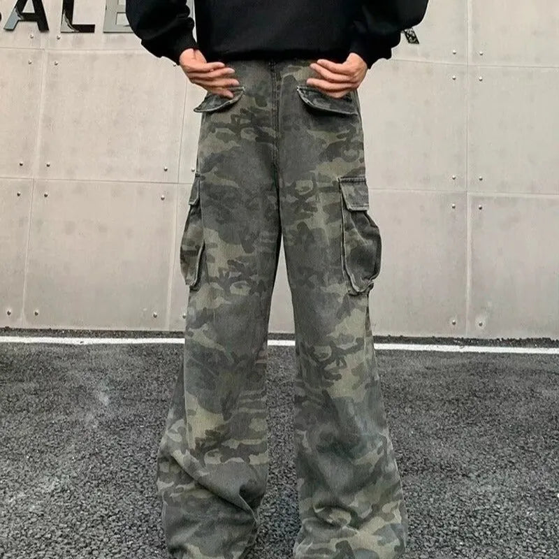 Men's loose-fit camouflage cargo pants with multiple pockets on a washed vintage-style fabric.