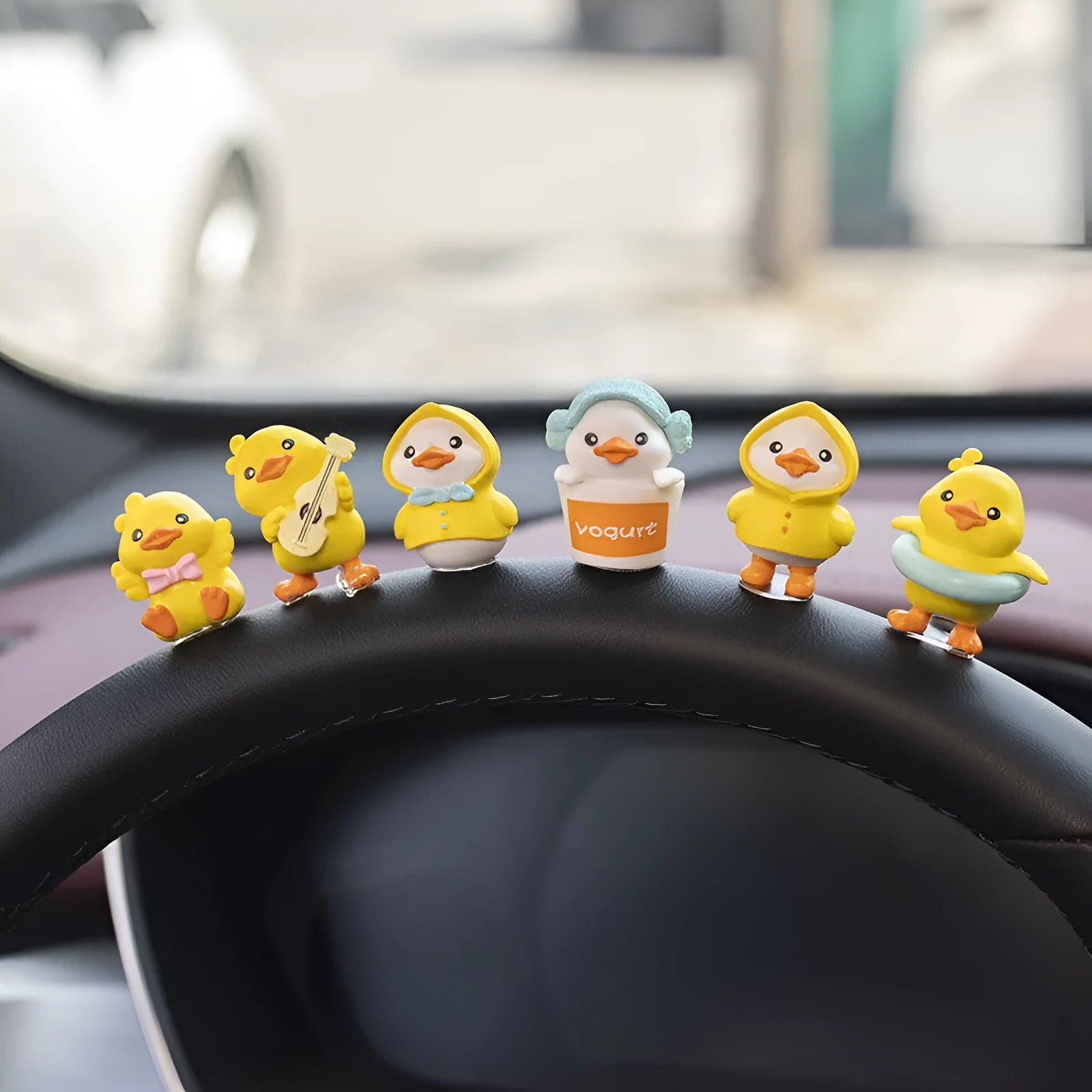 Set of six small PVC cartoon duckling car decorations with hello sign on car dashboard