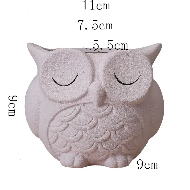Handmade frosted owl ceramic succulent pot in light pink, showing cartoon design and 11cm size.