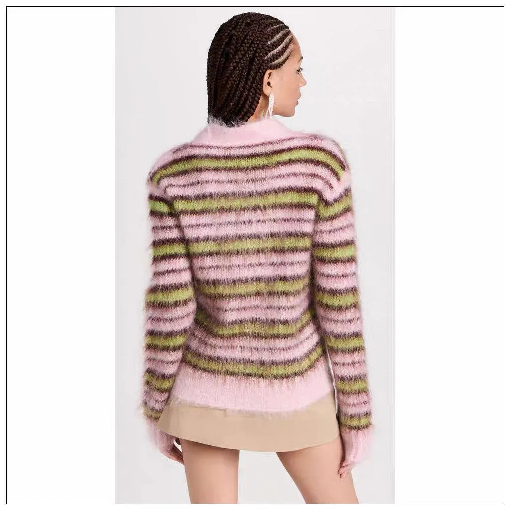 Pink lazy coat style wool blend cardigan with contrast colour detailing on a hanger.