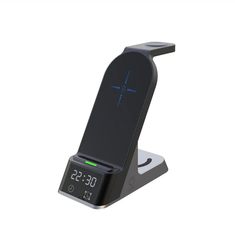 Black six-in-one wireless charging alarm clock with colour display on a nightstand.