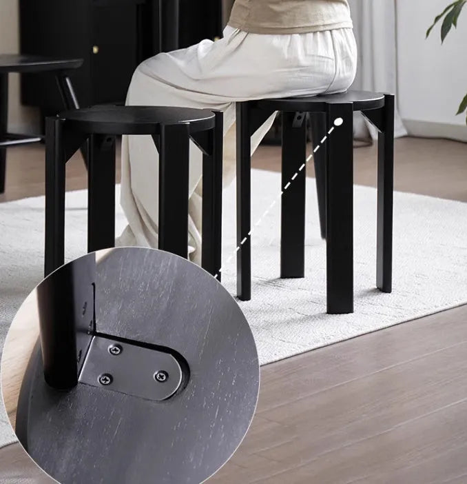 Stackable iron round dining stool in cream colour, showing clean lines and sturdy metal frame.
