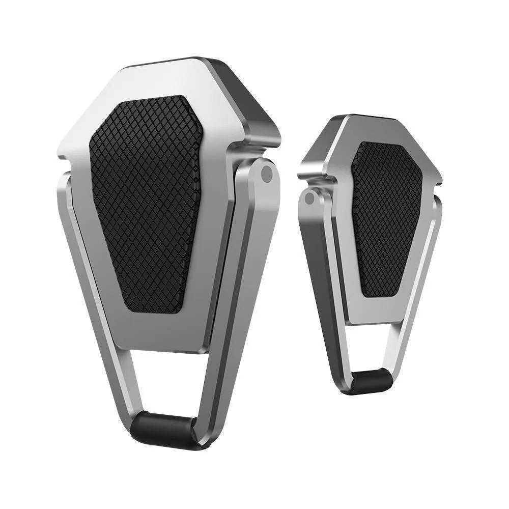 Silver foldable aluminium laptop bracket shown next to 3M adhesive glue on desktop