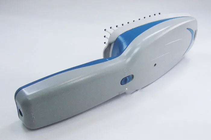 White pet ion comb with removable brush head and 78 comb teeth on a blue background.