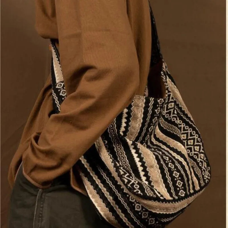 Retro striped corduroy messenger bag with adjustable shoulder strap showing jacquard pattern