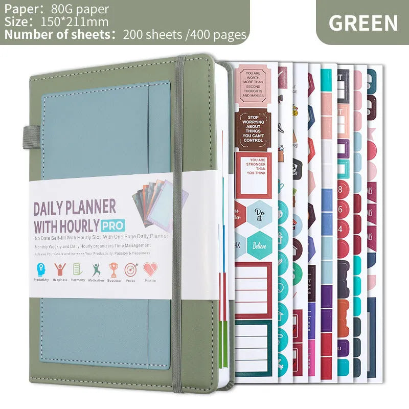 A5 notebook with PU leather cover in matcha green, lying open on a desk