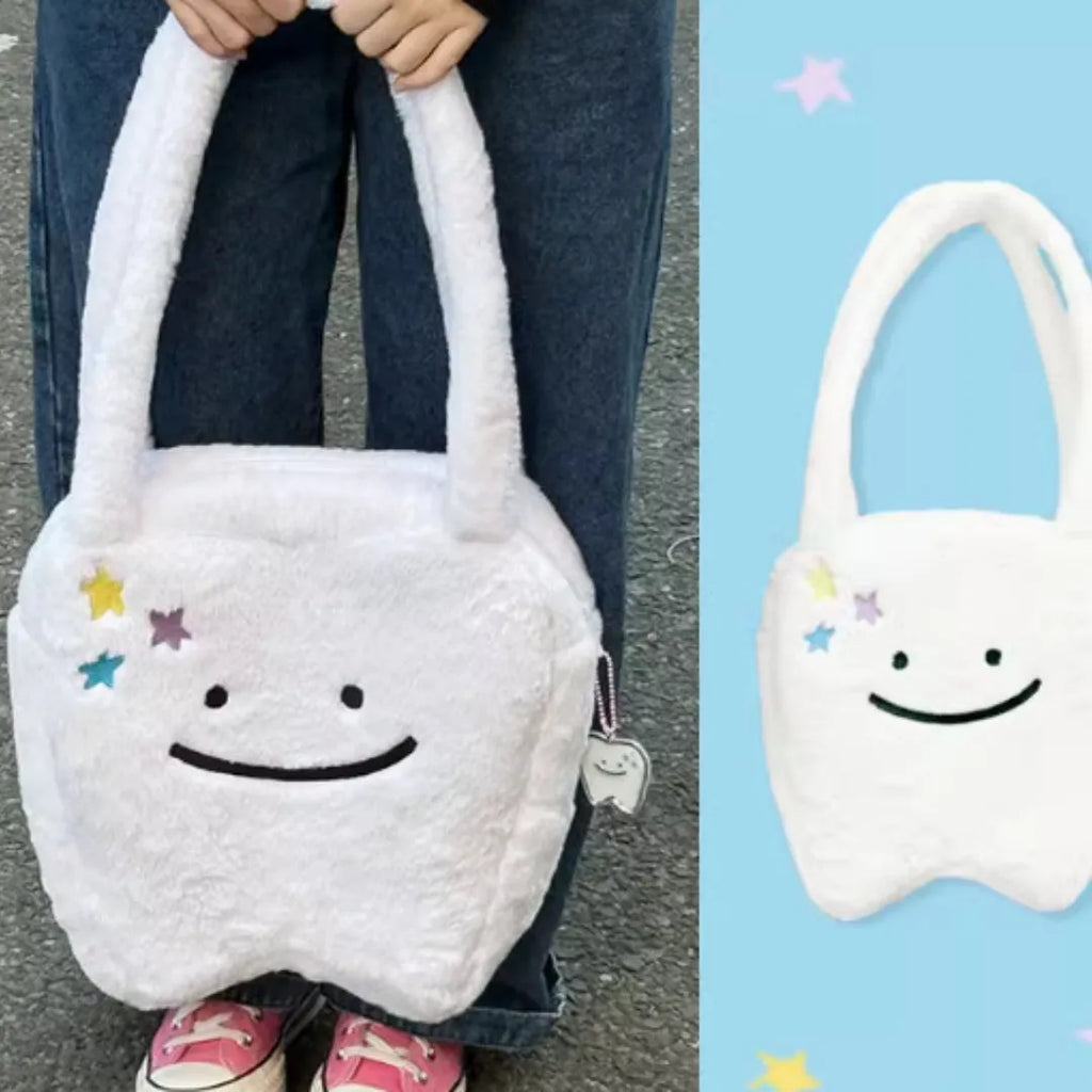 White plush large tooth design shoulder tote bag with crossbody strap and zipper opening
