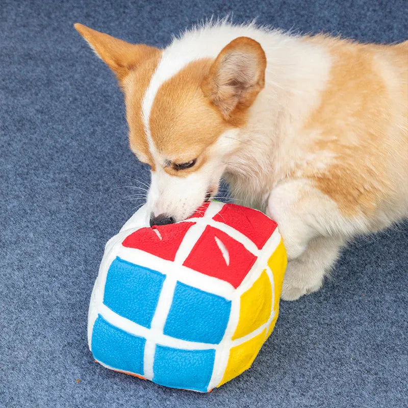 Pet Rubik's Cube sniffing toy in polar fleece fabric with treats visible, 15cm cube on a light background