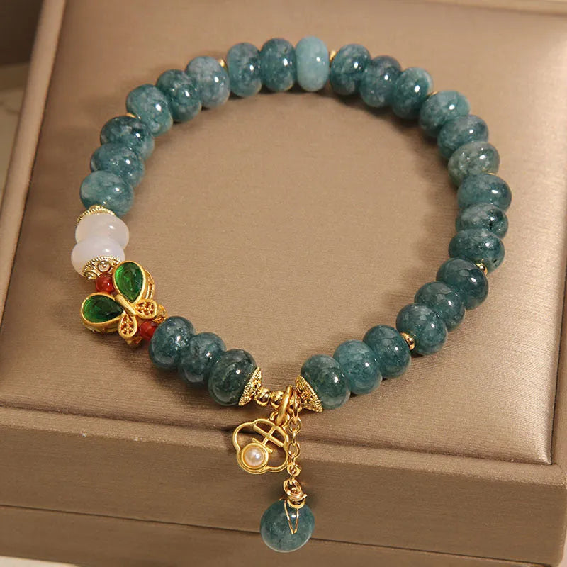 Blue jade abacus beads crystal bracelet with alloy inlay, rhinestone accents, butterfly charms and white agate beads