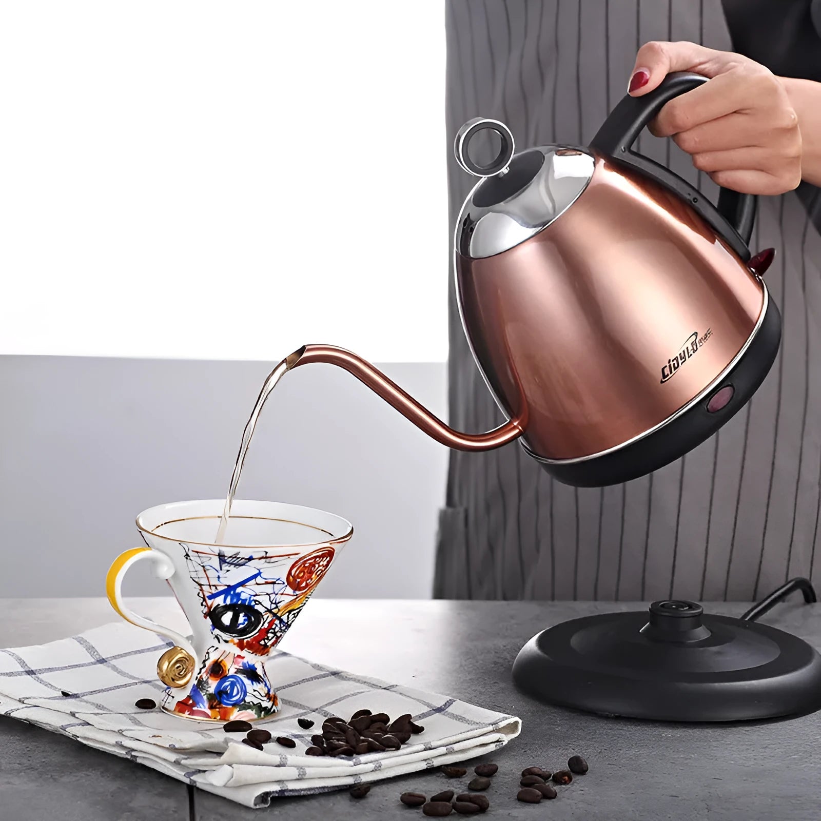 Gold full-automatic stainless steel kettle with touch controls and 1L capacity for making coffee.