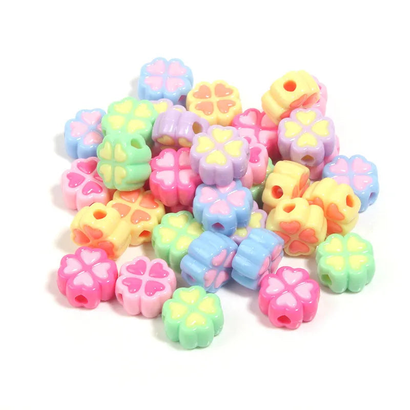 15mm acrylic clover craft beads with frosted finish in multiple colours including pink, blue, yellow, and green