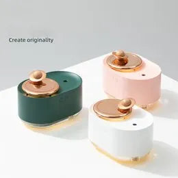 Rotating planet humidifier with night light in green, pink, or white colours showing USB port and mist output