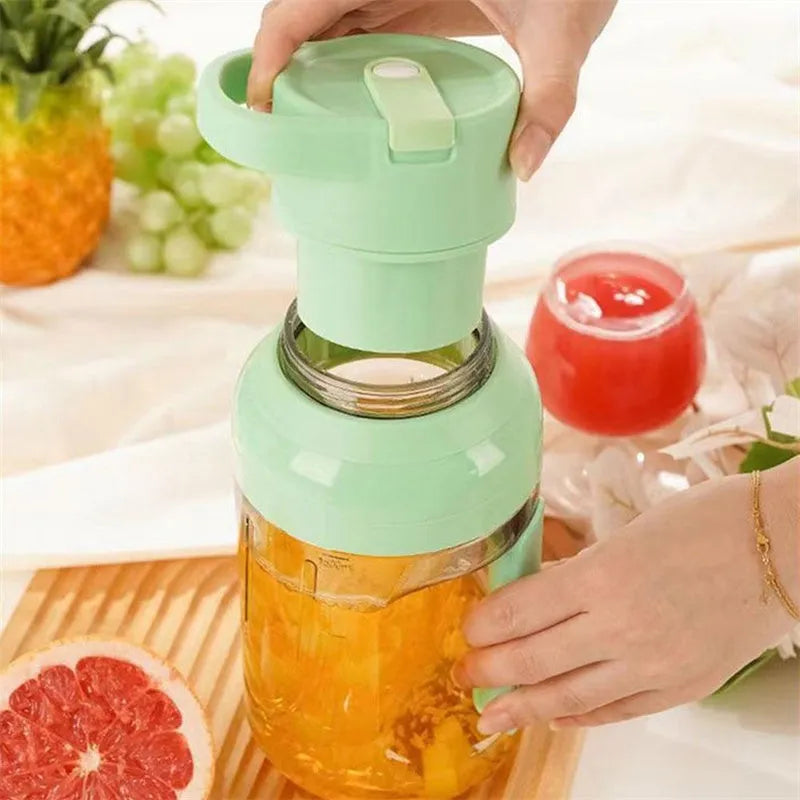 Portable electric juicer blender with 1500ml capacity in emerald green colour, showing USB charging port and double handles.