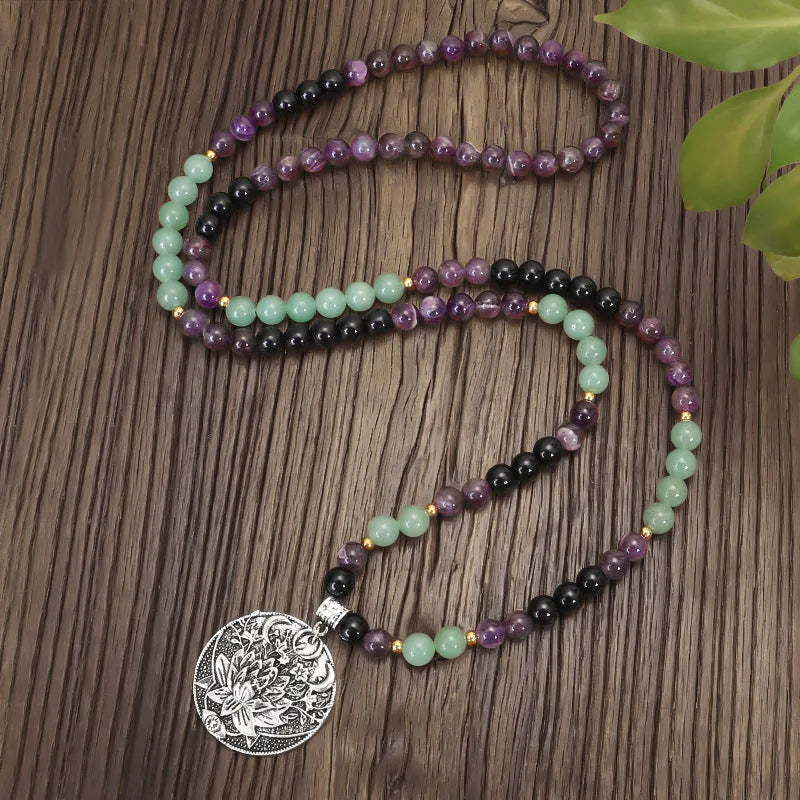 Dongling long necklace with geometric lotus pendant and adjustable cord alongside matching bracelet