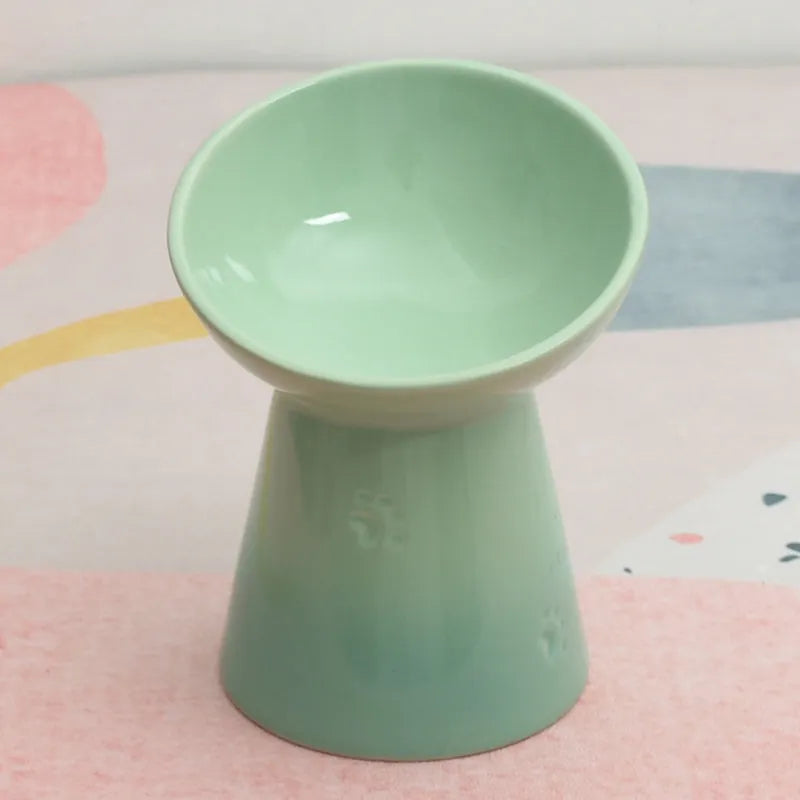 White ceramic pet bowl with a high foot neck and slanted rim for cat or dog feeding