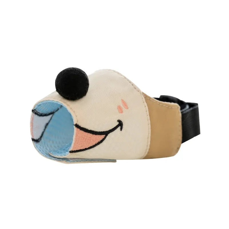 Adjustable canvas dog muzzle in Ollie Brown Bear colour, shown on a dog's snout with straps fastened.