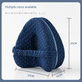 Heart-shaped dark blue memory foam leg pillow for adult use.