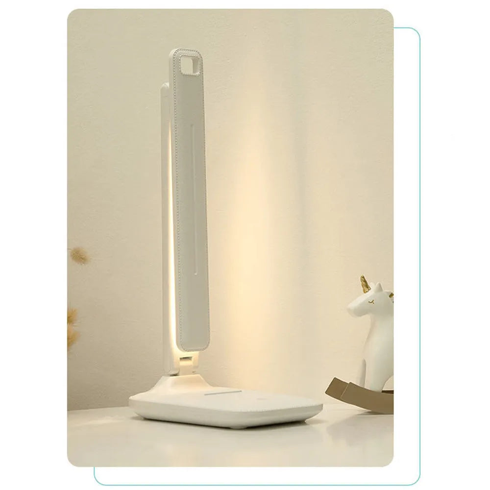 White plastic USB rechargeable bedside lamp with touch dimming for children's bedrooms.