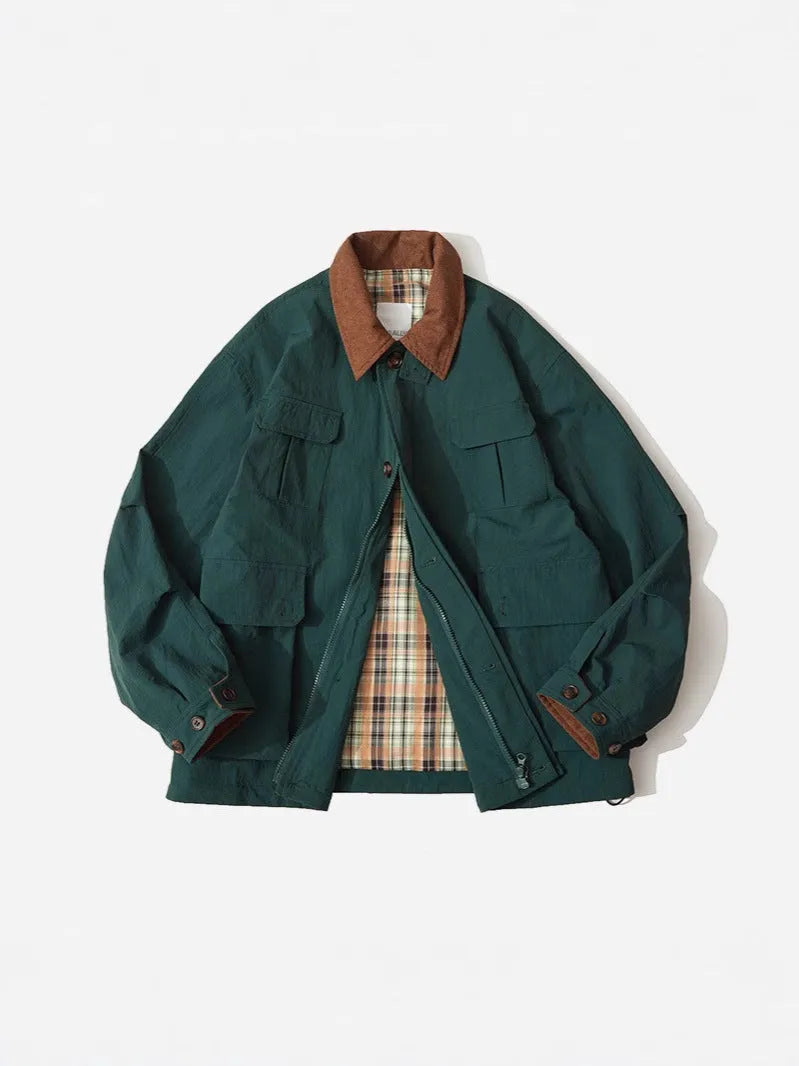 Casual apricot and green polyester jacket with side seam pockets on a hanger.