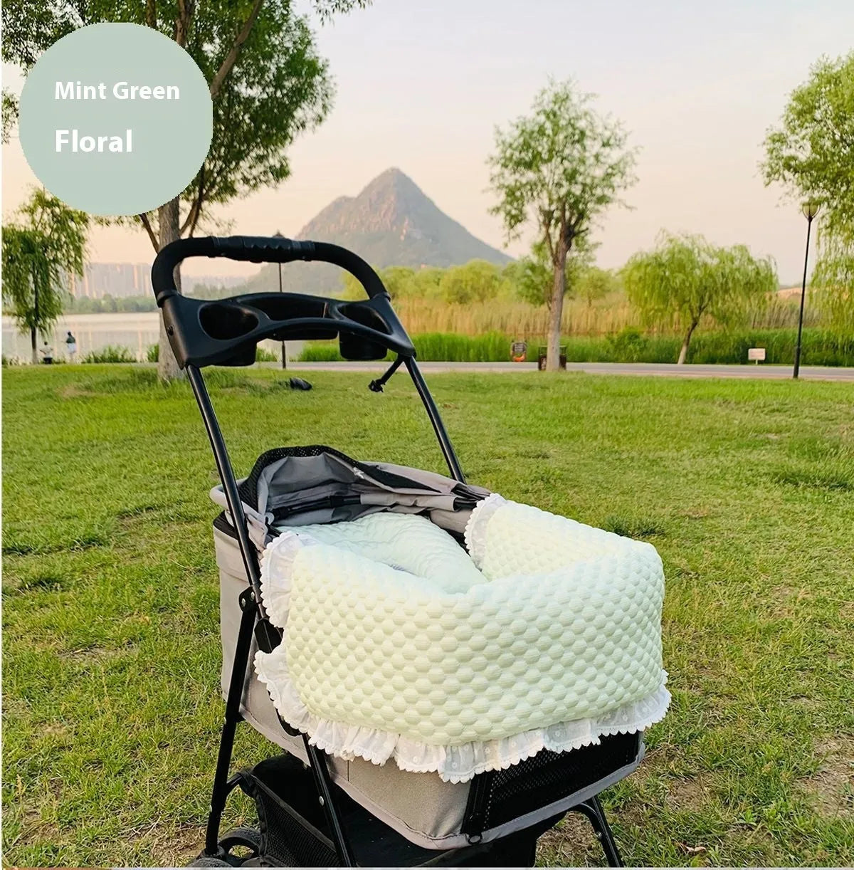 A green grey striped towel, cushion, and pillow set for a pet stroller, shown removed and ready for washing.