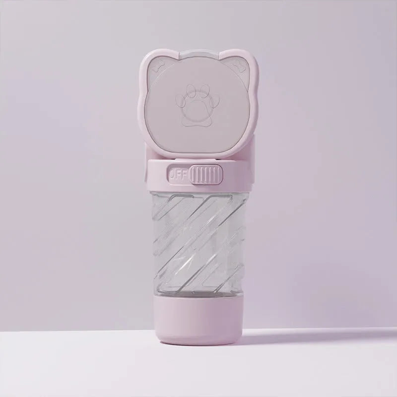 Green, pink, or white 3-in-1 portable pet water bottle with food container and garbage bag dispenser attached to a strap.