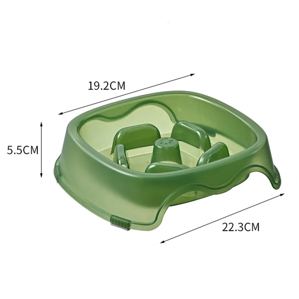 Blue plastic slow-feed dog bowl on a floor to prevent choking.