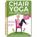 Green coil-bound 30 Days Chair Yoga Training Guide notebook lying open.
