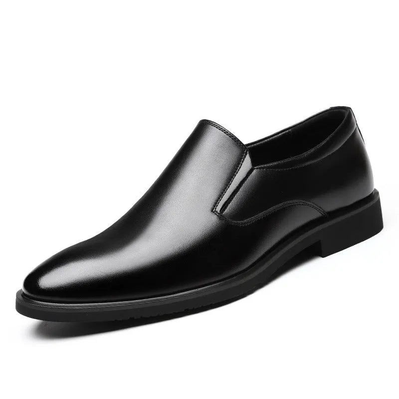Men's black low-top slip-on leather shoes with a rubber sole and sewing line detailing.
