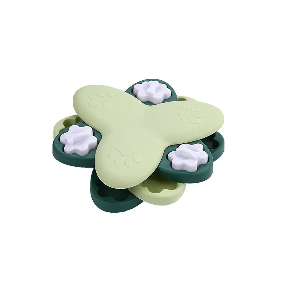 Green and yellow interactive dog puzzle toy slow feeder bowl with nine bone-covered compartments.