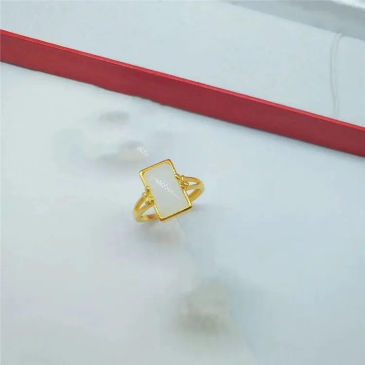 Gold-plated brass adjustable ring with a choice of black, green, or white gemstone inlays.
