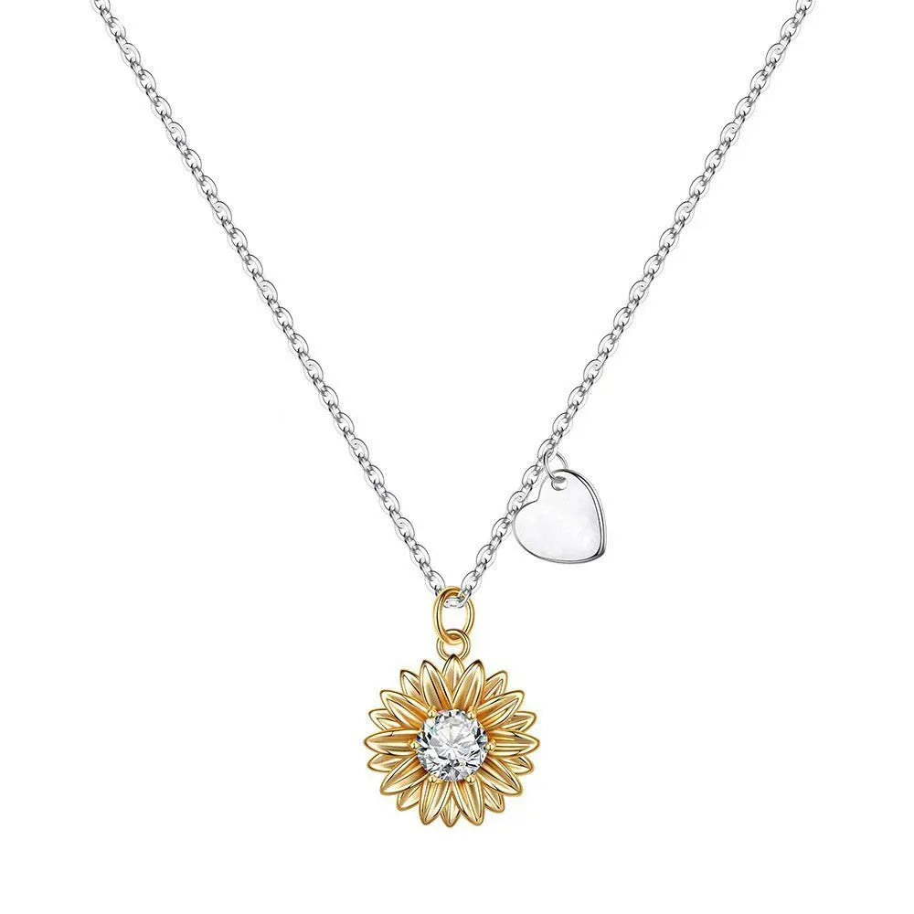 Close-up of a geometric sunflower pendant necklace on an adjustable silver cross chain.