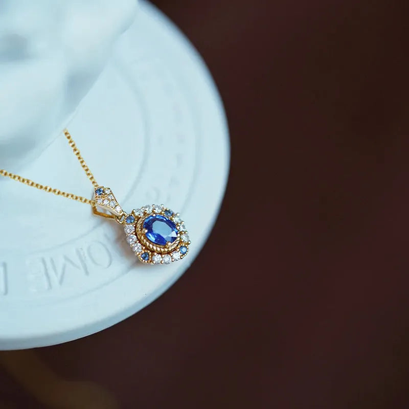 Huitan adjustable yellow gold colour necklace with a mixed gem inlaid pendant on a box chain.