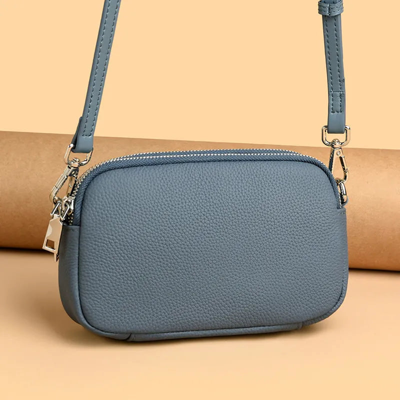 Small square shoulder messenger bag in first layer cowhide with sewing line detail