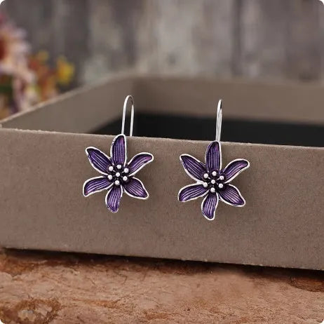 A pair of purple retro flower-shaped alloy earrings with an electroplated finish.