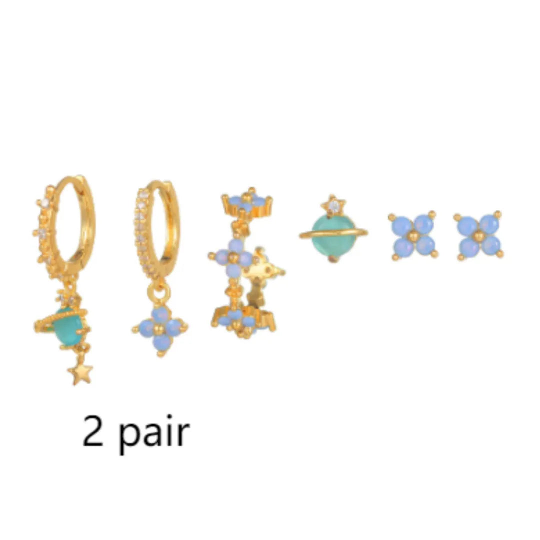 Gold and silver floral ear studs with blue zircon flower nail detail in Japanese Korean style