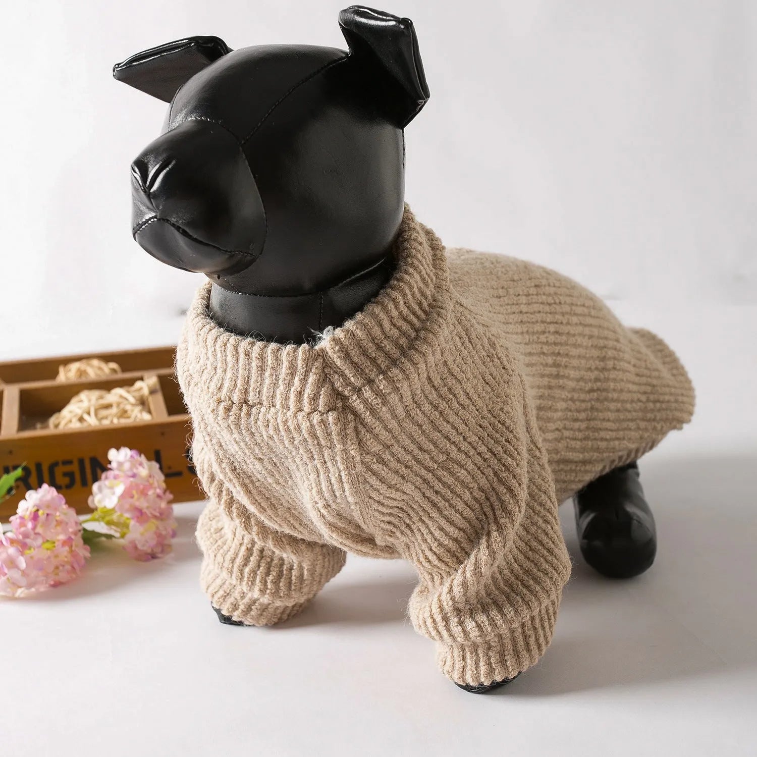 Brown knitted pullover sweater on a small dog, showing casual design and soft fabric.
